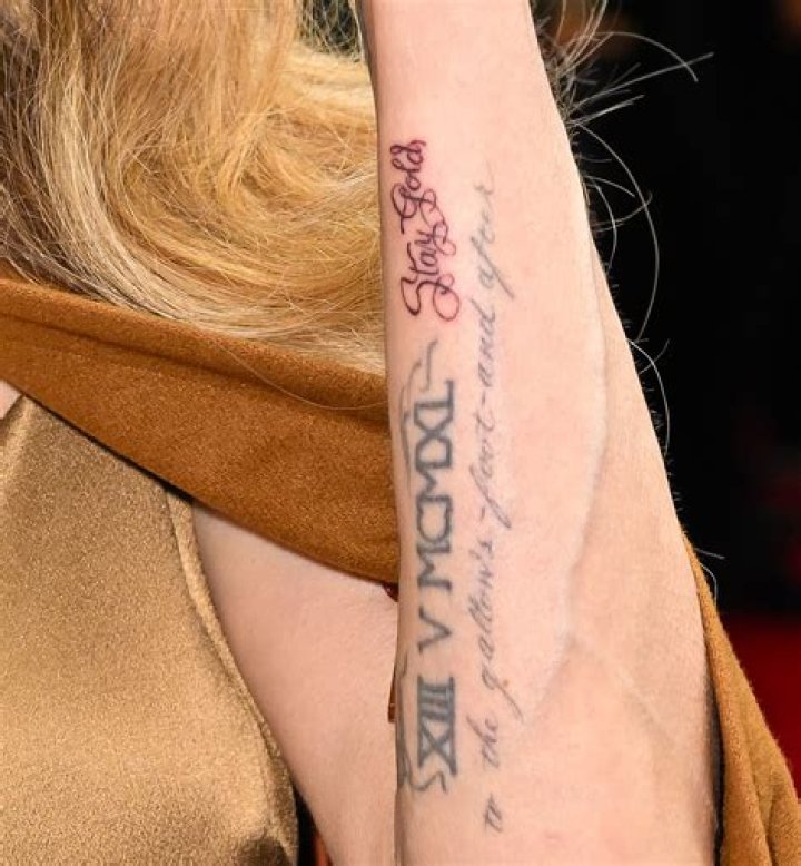 Unveiling The Symbolism And Meaning Behind Angelina Jolie's Arm Tattoo